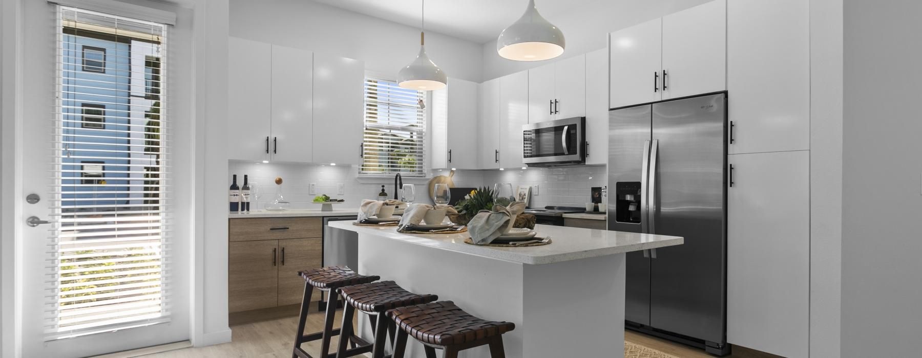 a kitchen with white cabinets