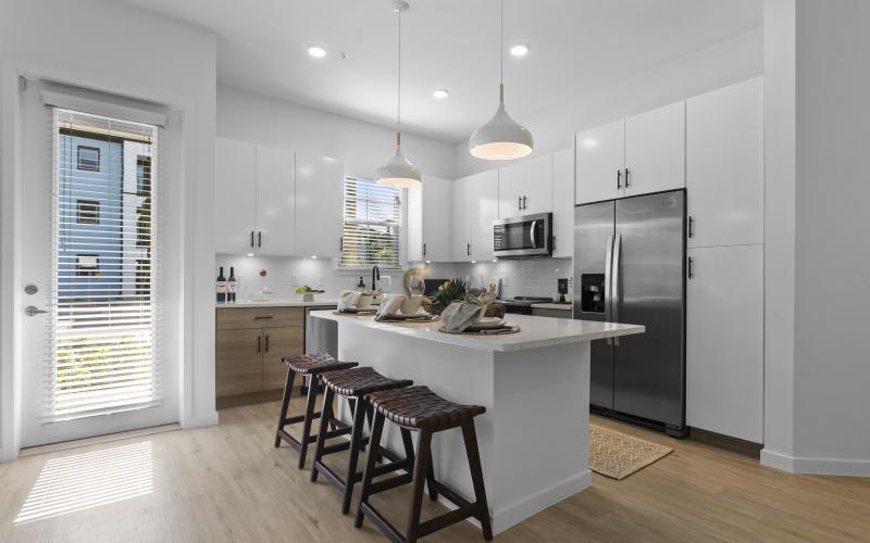 a kitchen with white cabinets